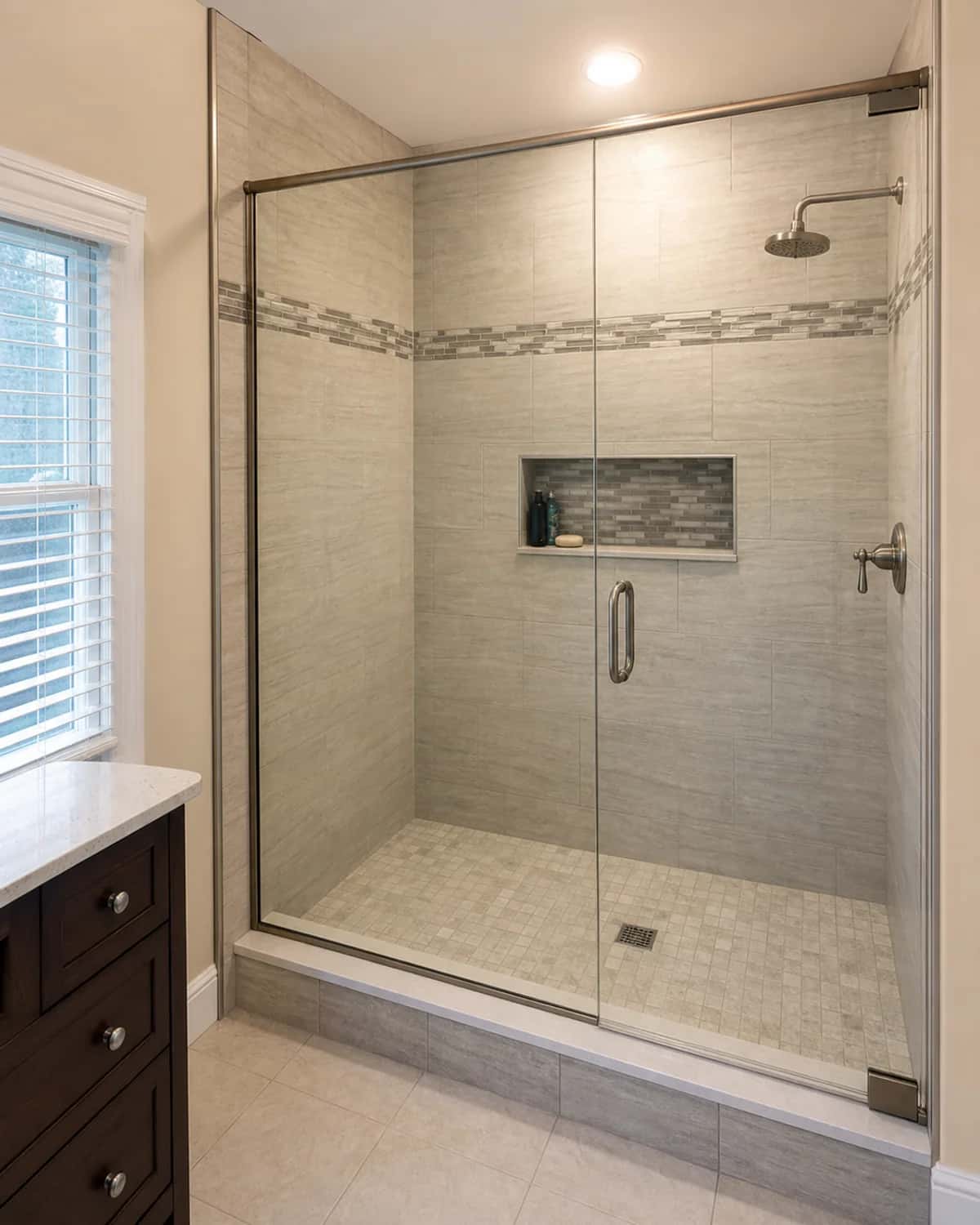Custom bathroom shower remodel with detailed tile and modern fixtures