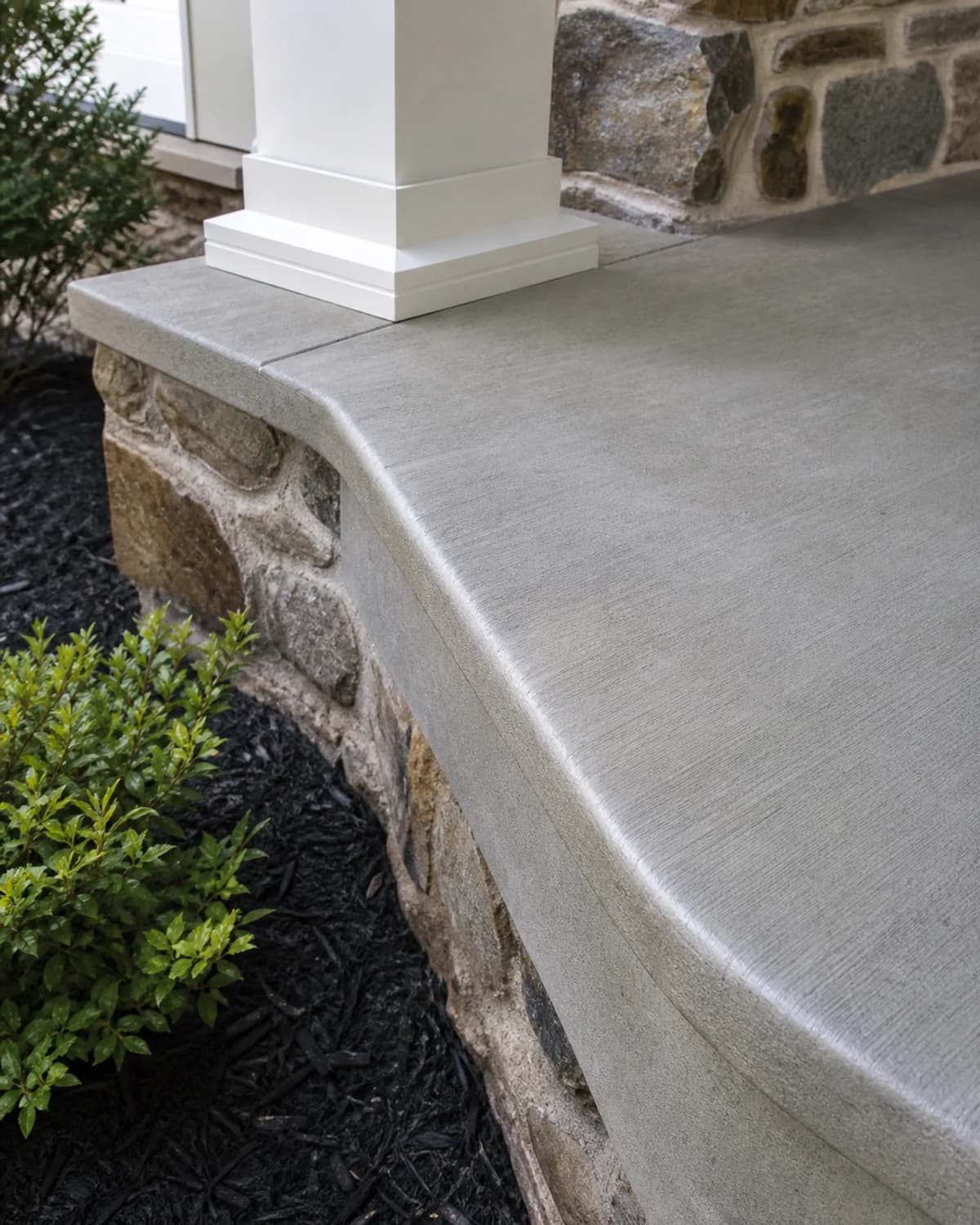 Specialty concrete detail showing edge form, radius, texture, small pour, repair, surface finish, or custom concrete shape