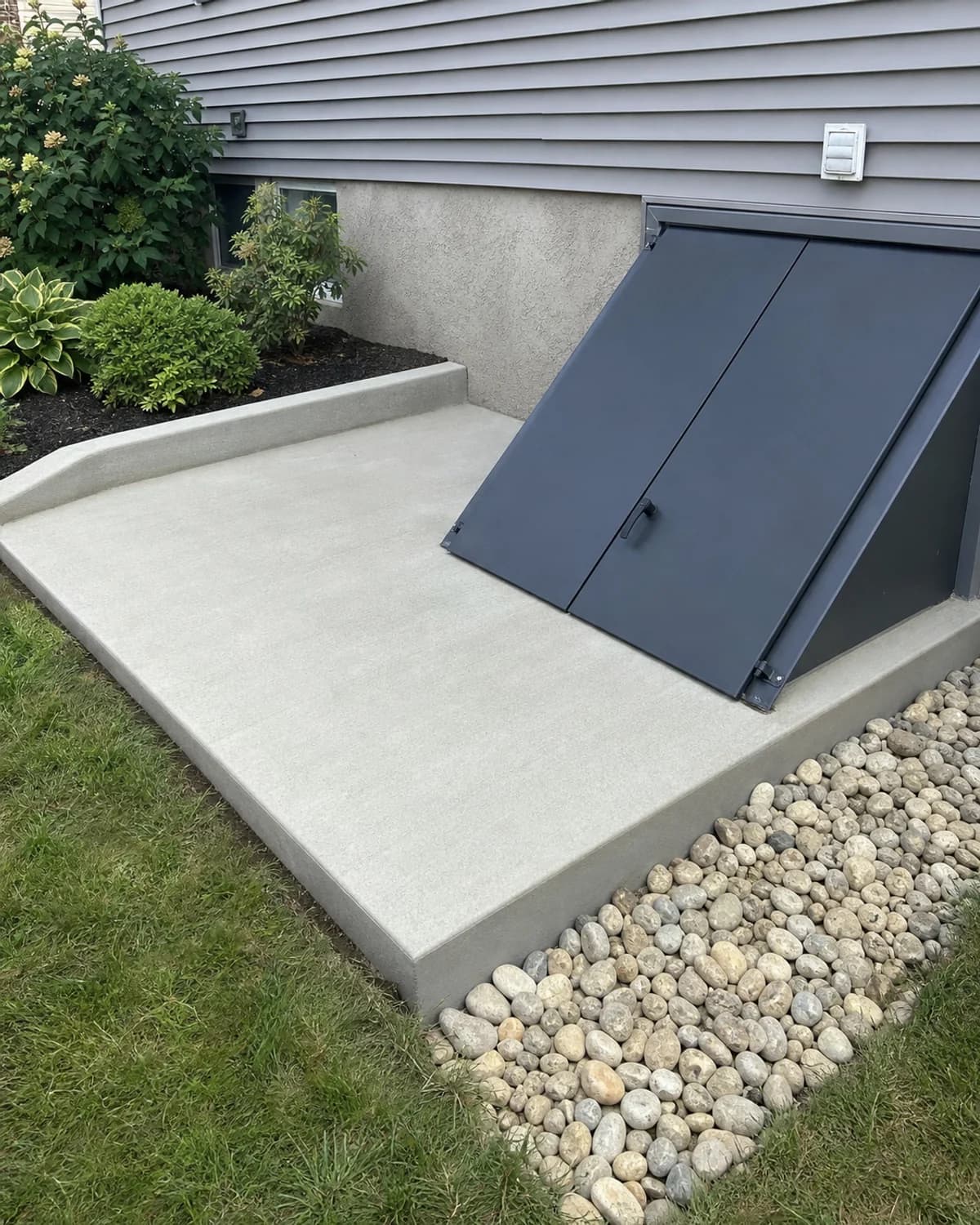 Small custom concrete feature that solves a practical site or access need with clean finish and realistic site integration