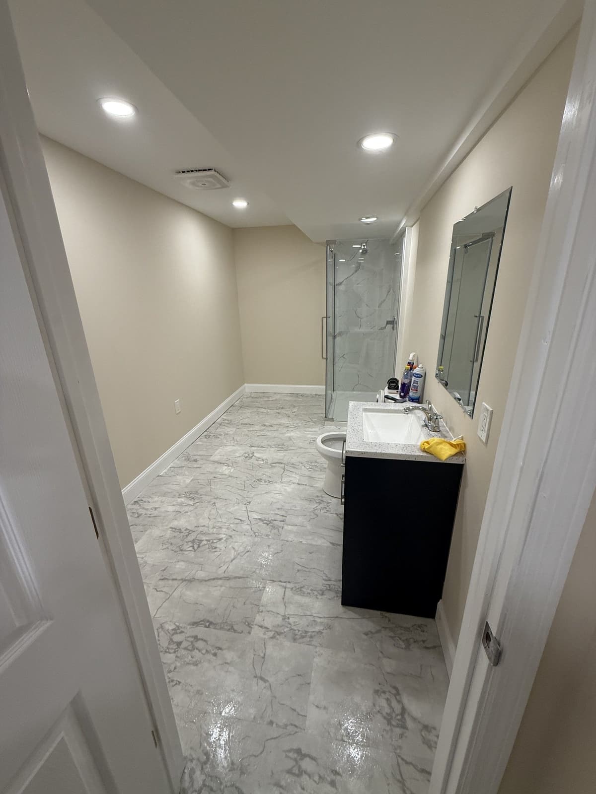 Basement remodel with upgraded lighting and built-in storage