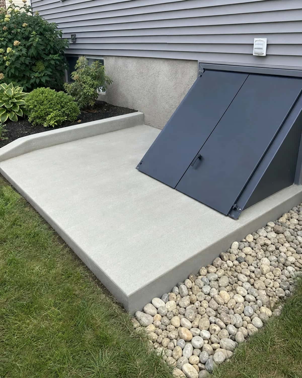 Small custom concrete feature that solves a practical site or access need with clean finish and realistic site integration
